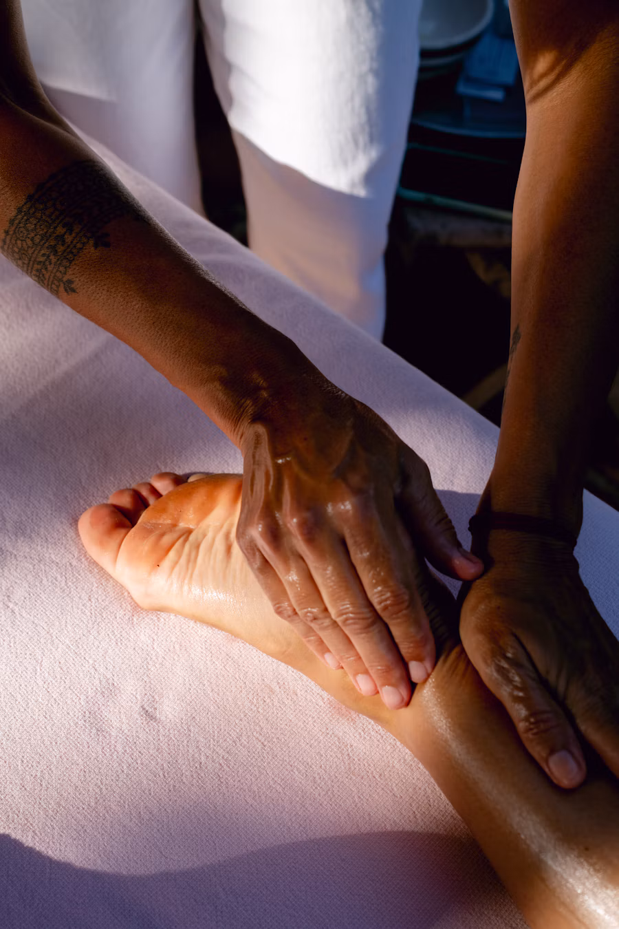 Foot massage on a treatment bed