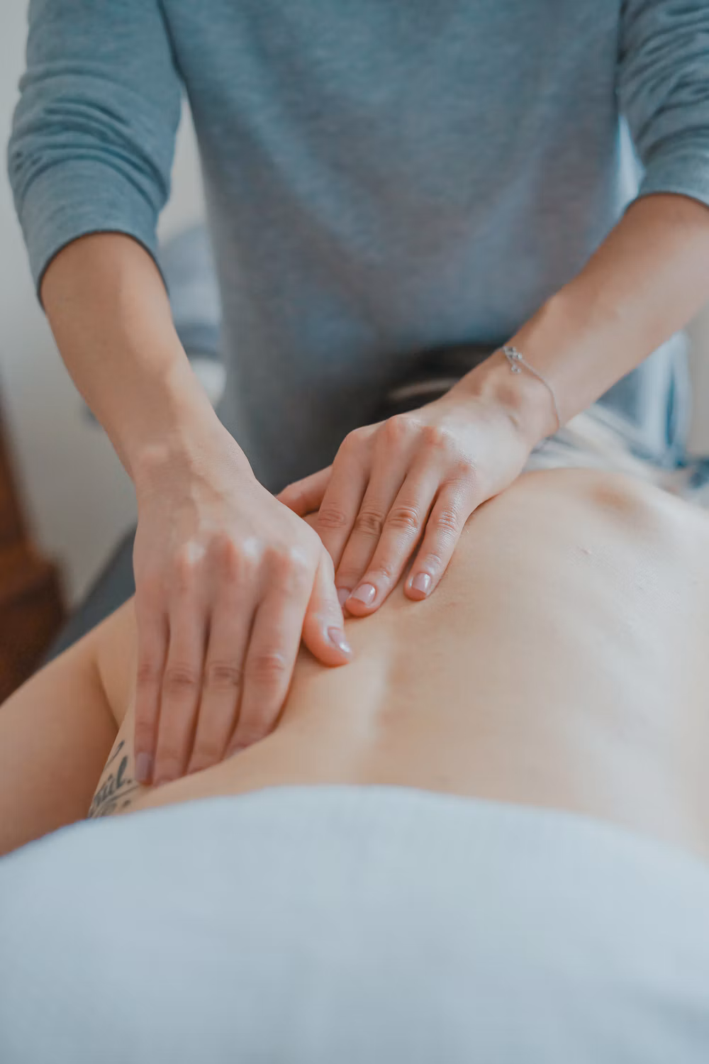 Therapist giving a body massage